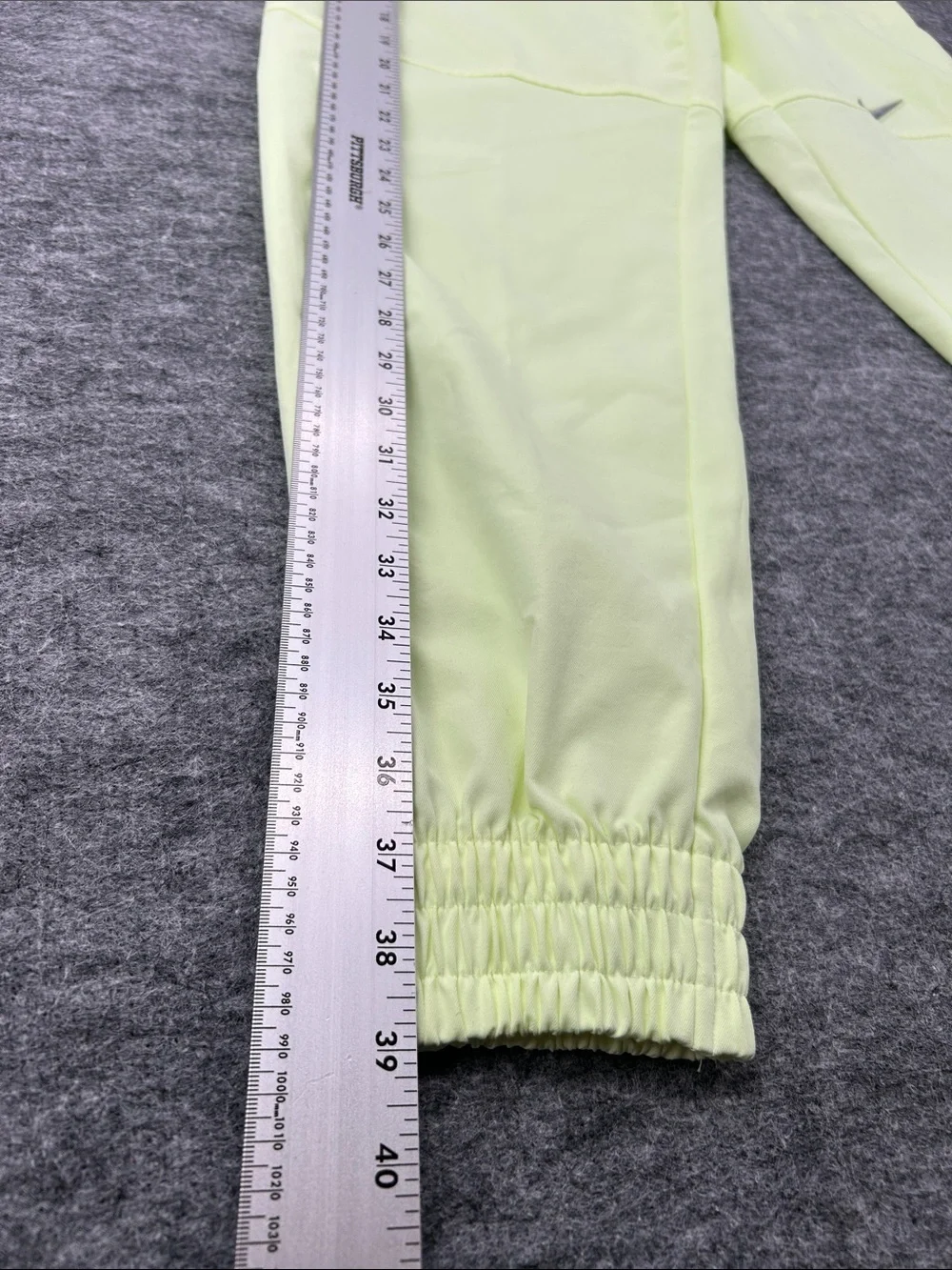 Nike Women's Sportswear Woven Pants in a bright neon green/yellow XS